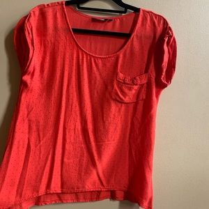 Orange tee with dark blue polka dots